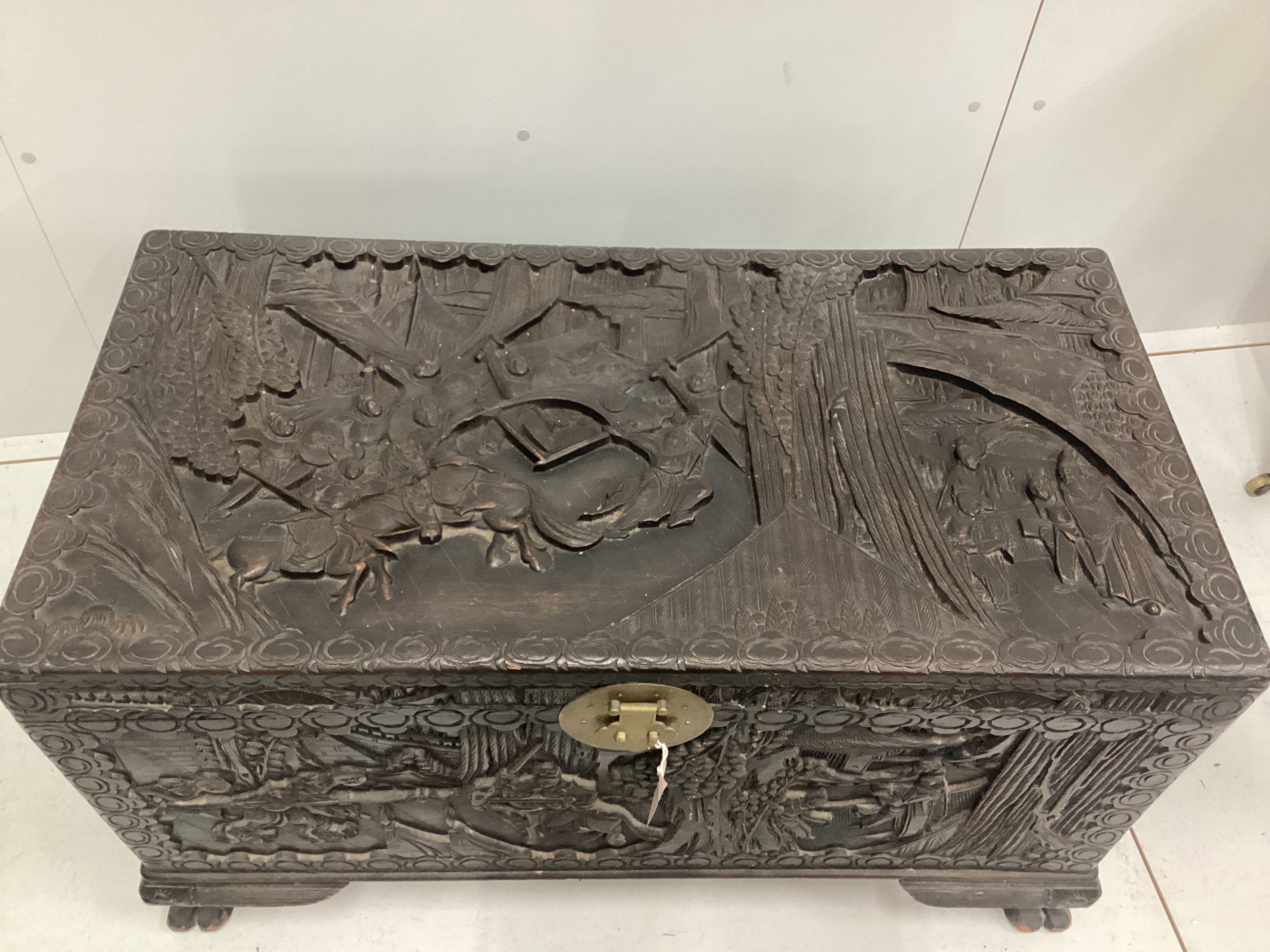 A late 19th century Cantonese carved camphorwood chest, width 100cm, Please note this lot attracts an additional import tax of 5% on the hammer price